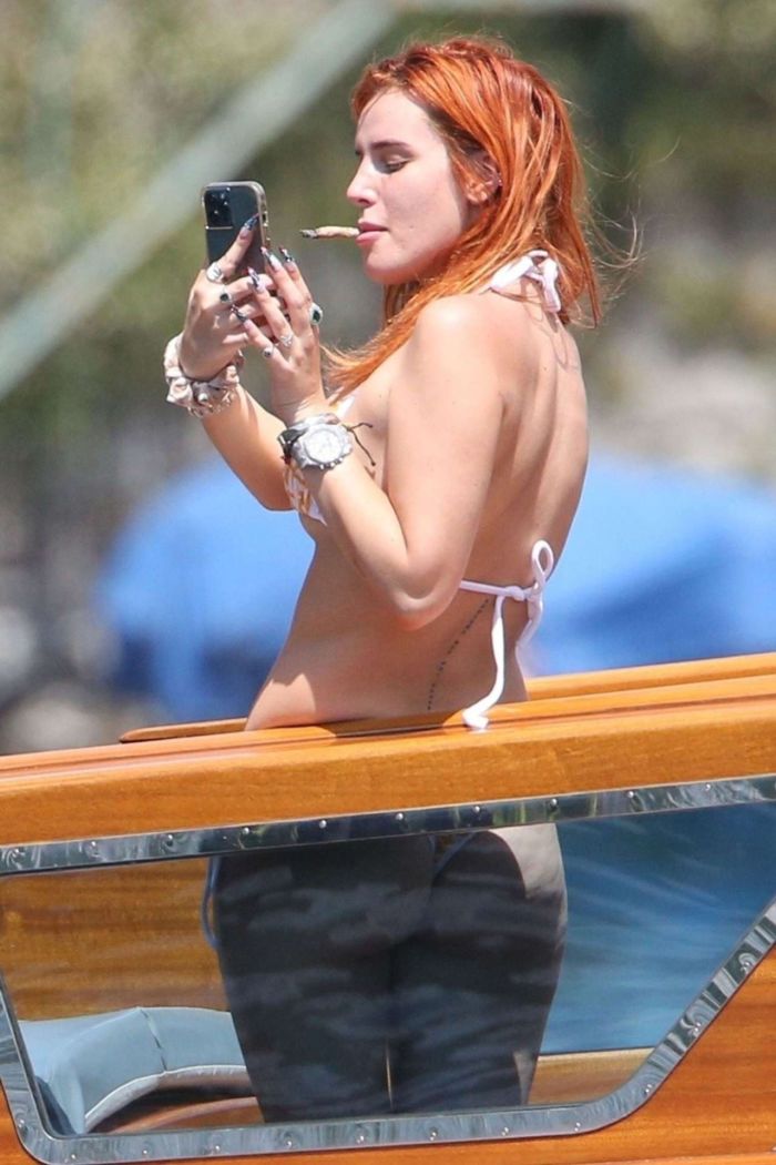 Bella Thorne Enjoying In Orange Bikini On Lake Como In Italy
