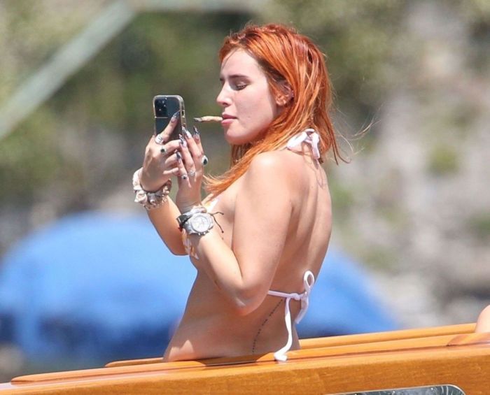 Bella Thorne Enjoying In Orange Bikini On Lake Como In Italy
