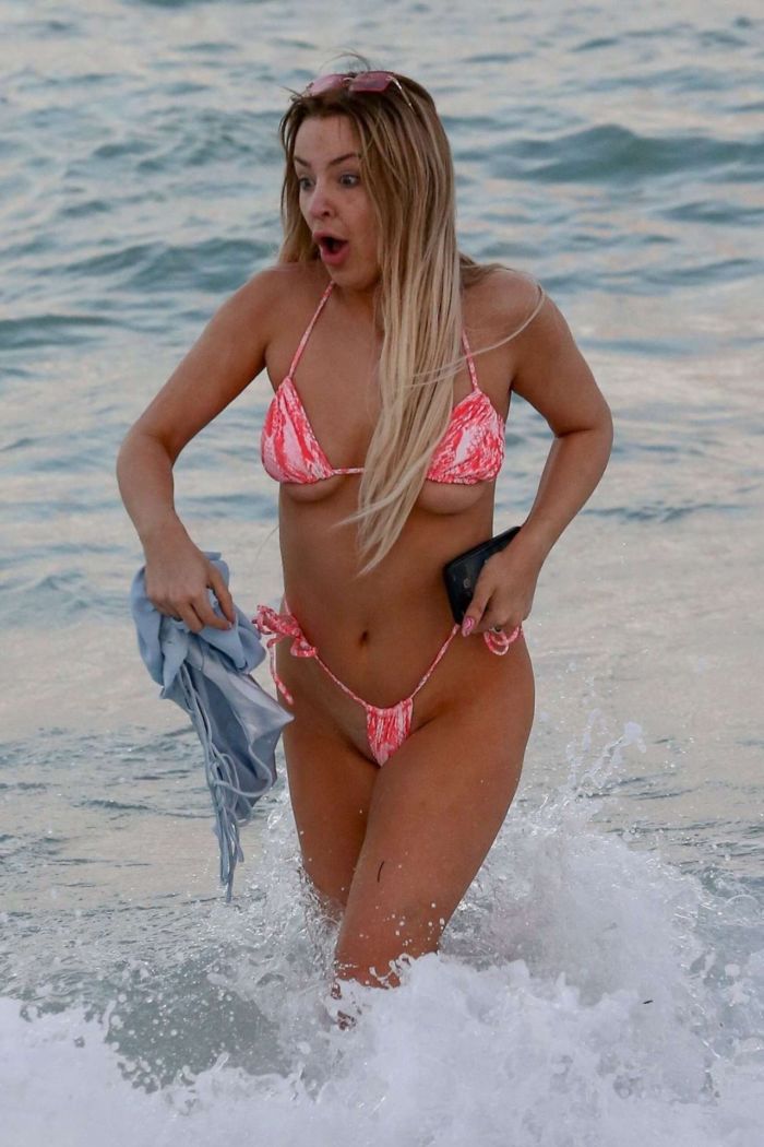 Tana Mongeau Hits The Beach In A Pink Bikini