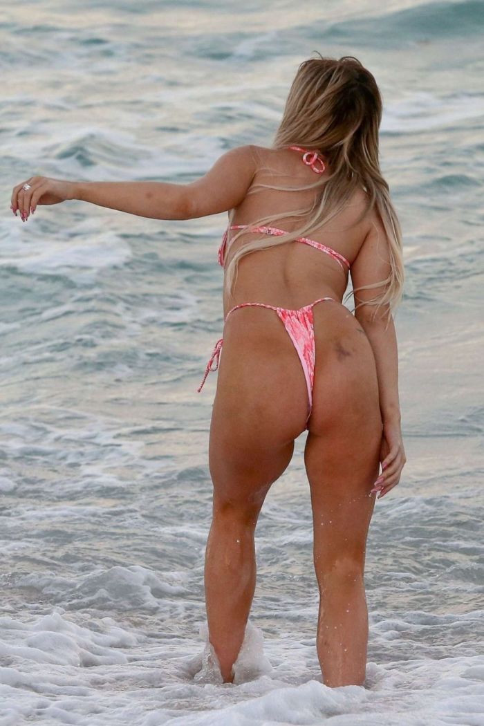 Tana Mongeau Hits The Beach In A Pink Bikini